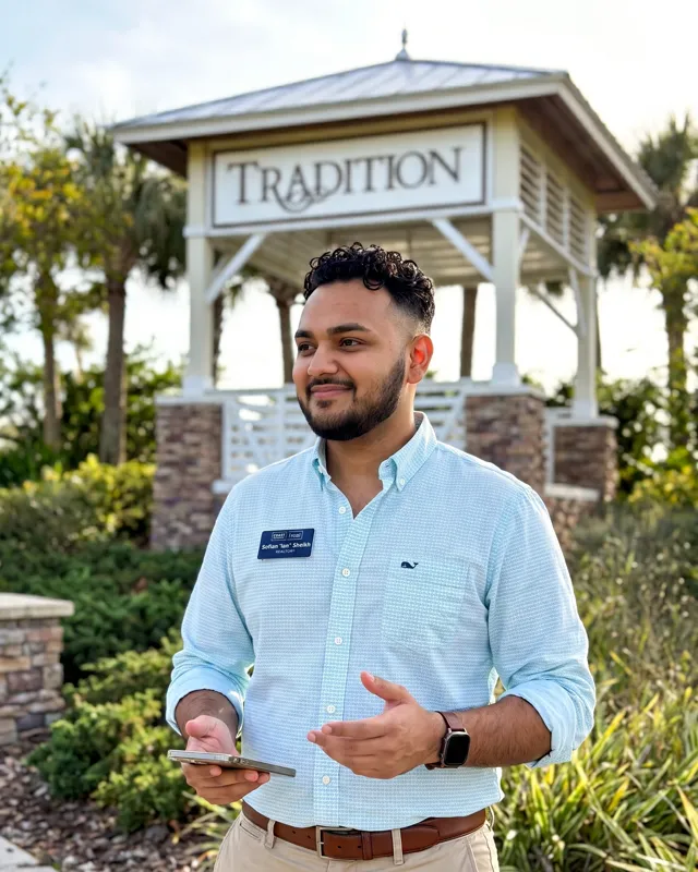 Ian Sheikh, REALTOR, at the Tradition entrance sign in Port St. Lucie